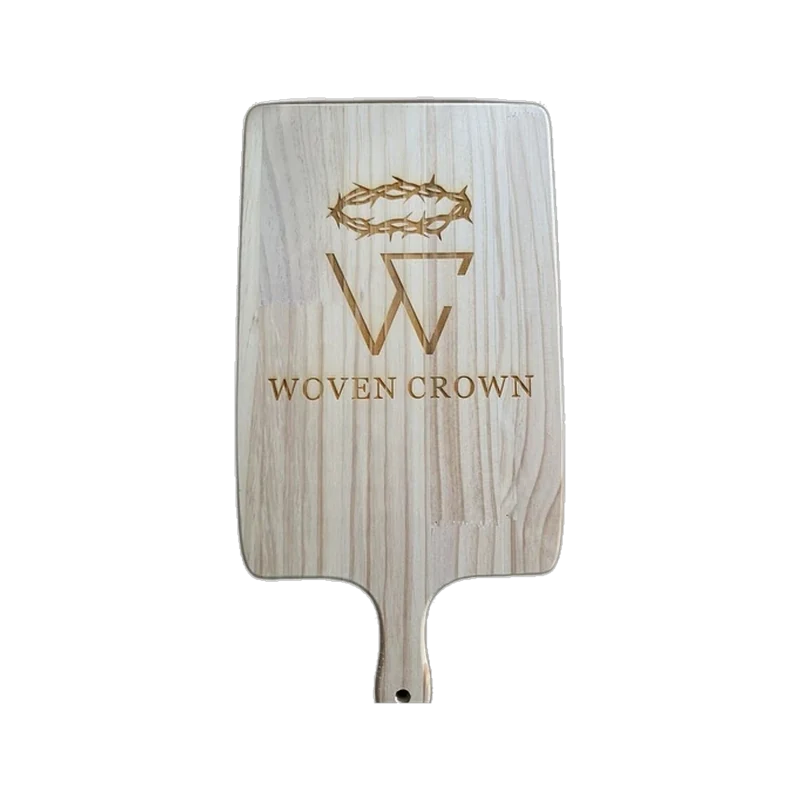Woven Crown logo engraved on a wood serving board