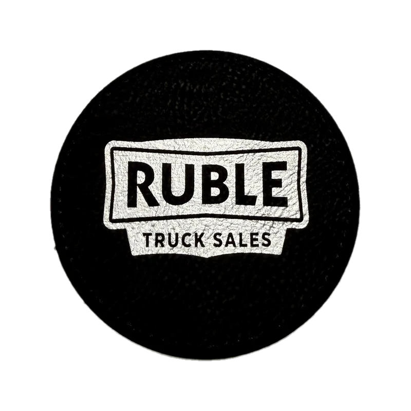 Custom laser-cut leather logo patch made for Ruble Truck Sales
